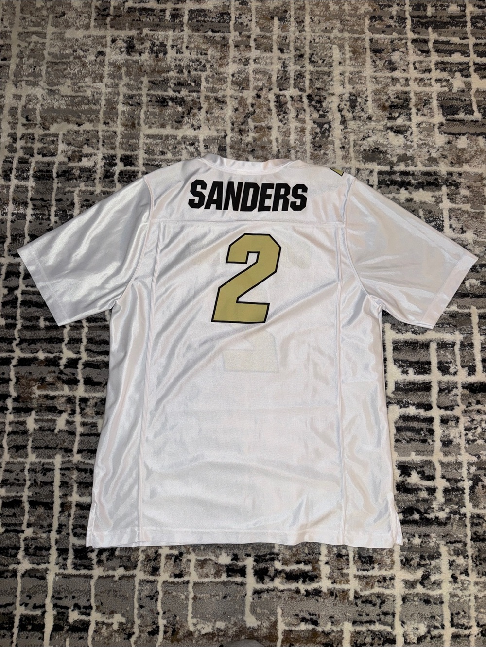 Sheduer Sanders Athletic Jersey with Gold Number